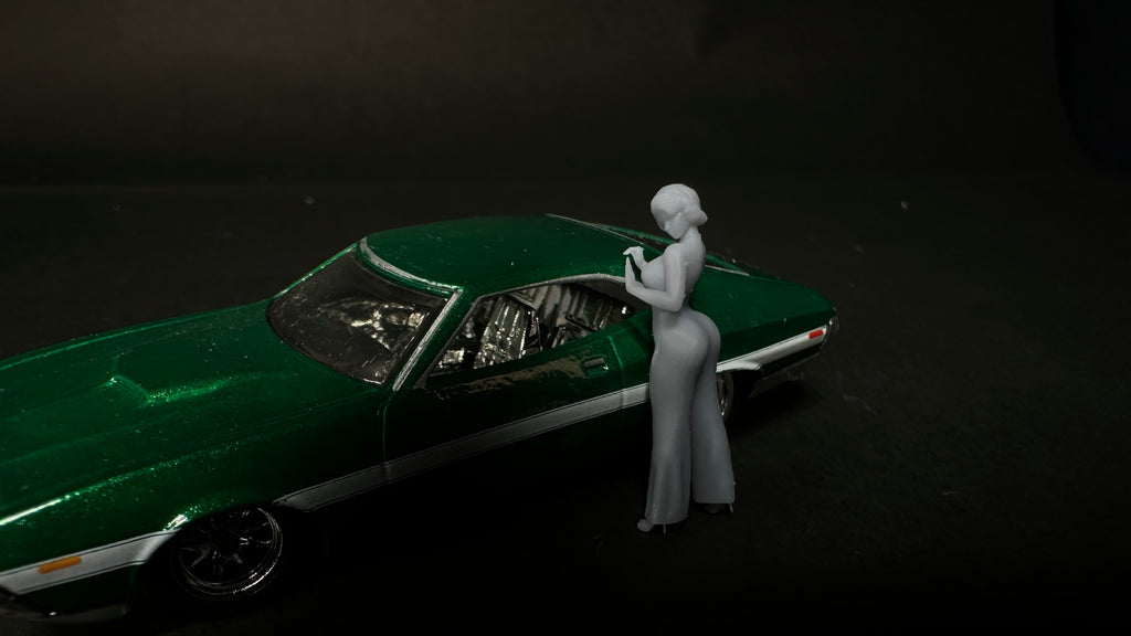 pantsuit leaning on car